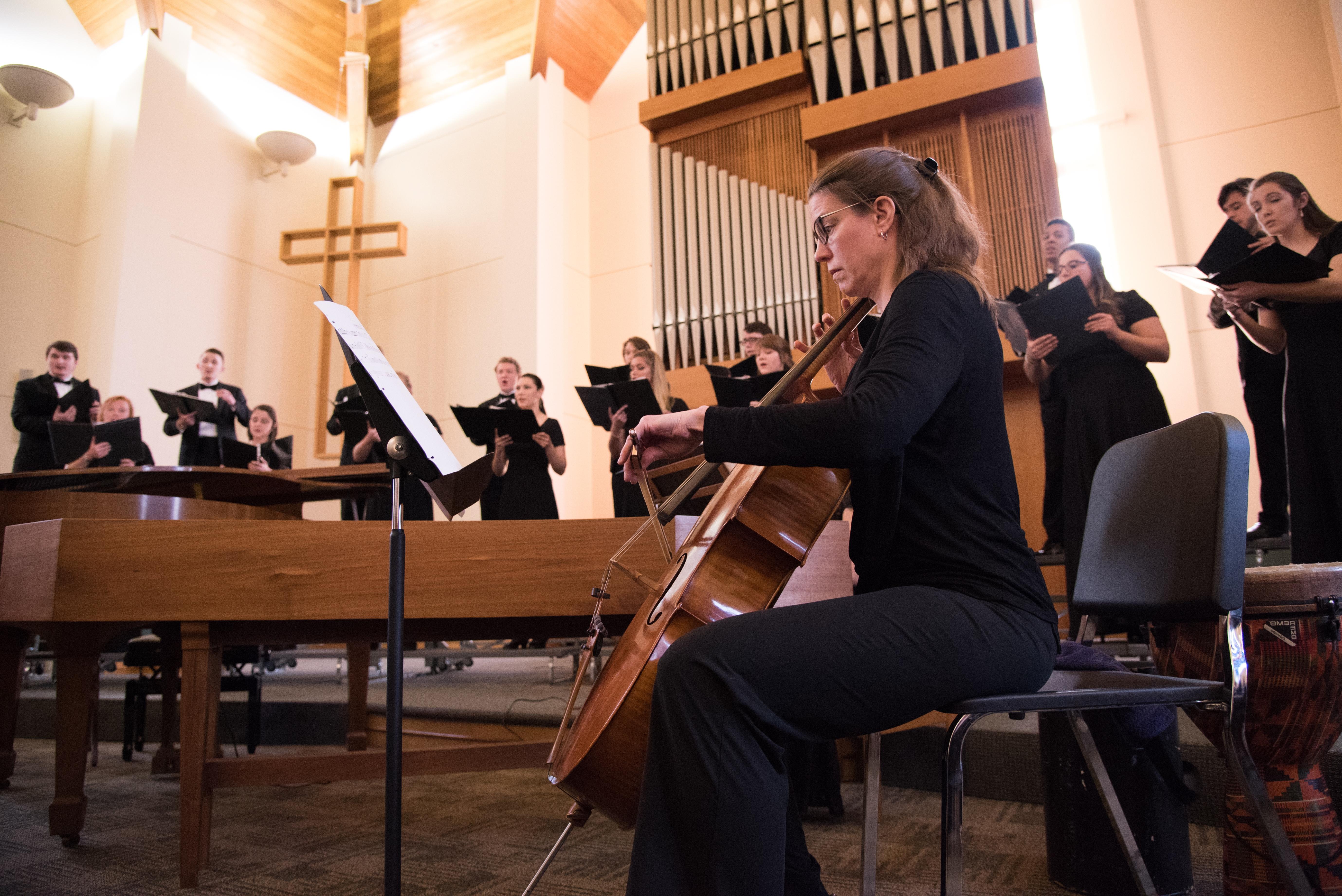 Cellist playing with choir